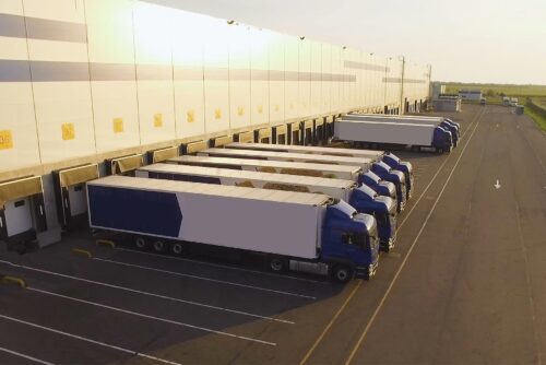 trucks parked at a distribution center